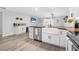 Kitchen with white cabinets, butcher block island, and bar at 300 S Brighton Dr, Port Orange, FL 32127