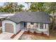 Newly renovated home with gray exterior and a small front porch at 3012 Amherst Ave, Orlando, FL 32804