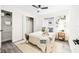 Cozy bedroom with a queen bed, ample closet space, and grey wood-look floors at 3012 Amherst Ave, Orlando, FL 32804