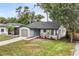 Newly renovated home with a gray exterior and small front porch at 3012 Amherst Ave, Orlando, FL 32804