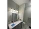 Bathroom with a gray vanity and marble countertops at 3367 S Kirkman Rd # 1116, Orlando, FL 32811