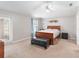 Spacious bedroom with a wooden bed frame and carpeting at 3418 Gator Bay Creek Blvd, St Cloud, FL 34772