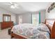 Main bedroom with a king-size bed and plenty of natural light at 3418 Gator Bay Creek Blvd, St Cloud, FL 34772