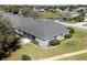 Rear view of house showing patio and surrounding landscape at 346 Hickory Springs Ct, Debary, FL 32713