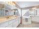 Elegant bathroom with double sinks, soaking tub, and shower at 346 Hickory Springs Ct, Debary, FL 32713