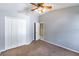 Simple bedroom with double door closet and ceiling fan at 346 Hickory Springs Ct, Debary, FL 32713