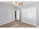 Secondary bedroom with double door closet and ceiling fan at 346 Hickory Springs Ct, Debary, FL 32713