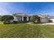 Single-story house with a two-car garage, manicured lawn and landscaping at 346 Hickory Springs Ct, Debary, FL 32713