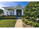 House exterior showcasing a front entrance with landscaping and walkway at 346 Hickory Springs Ct, Debary, FL 32713