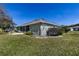 House exterior with partial view of backyard and landscaping at 346 Hickory Springs Ct, Debary, FL 32713