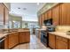 Kitchen with light wood cabinets, stainless steel appliances, and a breakfast bar at 346 Hickory Springs Ct, Debary, FL 32713