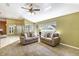 Spacious living room featuring two sofas and a ceiling fan at 346 Hickory Springs Ct, Debary, FL 32713