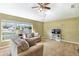 Bright living room with comfy sofas and large window at 346 Hickory Springs Ct, Debary, FL 32713