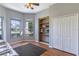 Sitting room with hardwood floors, built-in shelving, and large windows at 346 Hickory Springs Ct, Debary, FL 32713