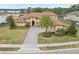 Grand home with a large driveway and palm trees at 3764 Farm Bell Pl, Lake Mary, FL 32746