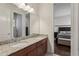 Shared bathroom with double vanity, granite countertops, and access to bedroom at 3764 Farm Bell Pl, Lake Mary, FL 32746