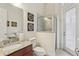 Bathroom featuring a granite countertop vanity, glass-enclosed shower, neutral tiling, and access to the outdoors at 3764 Farm Bell Pl, Lake Mary, FL 32746