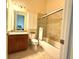 Clean bathroom with granite vanity and sliding glass shower at 3764 Farm Bell Pl, Lake Mary, FL 32746