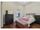 Spacious bedroom with a comfortable bed and ample storage at 3764 Farm Bell Pl, Lake Mary, FL 32746