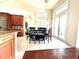 Kitchen breakfast nook with table and chairs near sliding doors at 3764 Farm Bell Pl, Lake Mary, FL 32746