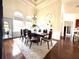 Bright dining room with hardwood floors and large windows at 3764 Farm Bell Pl, Lake Mary, FL 32746