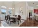 Elegant dining room with hardwood floors and large windows at 3764 Farm Bell Pl, Lake Mary, FL 32746