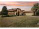 Luxury home with tile roof, three-car garage, and lush landscaping at 3764 Farm Bell Pl, Lake Mary, FL 32746