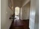 Bright hallway with hardwood floors and access to other rooms at 3764 Farm Bell Pl, Lake Mary, FL 32746