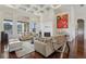 Living room with hardwood floors, fireplace, and access to pool at 3764 Farm Bell Pl, Lake Mary, FL 32746