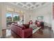 Red leather sofas and a large sliding door to a patio area at 3764 Farm Bell Pl, Lake Mary, FL 32746