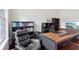 Home office with large desk and comfortable seating at 3764 Farm Bell Pl, Lake Mary, FL 32746