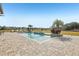 Resort-style pool with paver deck and tranquil water views at 3764 Farm Bell Pl, Lake Mary, FL 32746