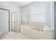 Bathroom featuring a soaking tub and walk-in shower at 3788 Brantley Place Cir, Apopka, FL 32703