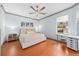 Bright bedroom featuring a king-size bed and backyard view at 3788 Brantley Place Cir, Apopka, FL 32703