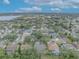 Aerial view of a residential neighborhood featuring mature trees and various house styles at 3838 Gatlin Place Cir, Orlando, FL 32812