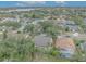 Aerial view of a residential neighborhood featuring mature trees and various house styles at 3838 Gatlin Place Cir, Orlando, FL 32812