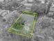 Aerial view of house, showing roofline, yard, and driveway at 3838 Gatlin Place Cir, Orlando, FL 32812