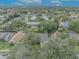 An aerial view showcasing a single Gathering home and neighborhood at 3838 Gatlin Place Cir, Orlando, FL 32812