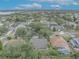 Aerial view of a residential neighborhood featuring mature trees and various house styles at 3838 Gatlin Place Cir, Orlando, FL 32812