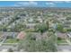 Aerial view of house, showing roofline, yard, and neighborhood at 3838 Gatlin Place Cir, Orlando, FL 32812