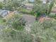 Aerial view of house, showing roofline, yard, and driveway at 3838 Gatlin Place Cir, Orlando, FL 32812