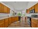 Kitchen with ample wood cabinets, and black appliances at 3838 Gatlin Place Cir, Orlando, FL 32812