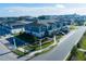 Aerial view of townhomes, showing a corner unit and landscaping at 4295 Campsite Loop, Orlando, FL 32824