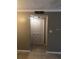 Hallway with neutral walls and bi-fold closet doors at 4653 Cason Cove Dr # 2713, Orlando, FL 32811