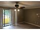 Living room with sliding glass doors to balcony at 4653 Cason Cove Dr # 2713, Orlando, FL 32811