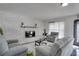 Bright living room featuring a modern fireplace and comfortable seating at 5005 Kipp Pl, Orlando, FL 32808