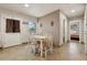 Cozy dining area with white table and chairs, near kitchen at 513 Seminole Ave, Fruitland Park, FL 34731