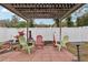 Patio area with pergola, fire pit, and seating at 513 Seminole Ave, Fruitland Park, FL 34731