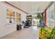 Sunroom with tiled floor and storage shelves at 513 Seminole Ave, Fruitland Park, FL 34731