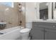 Clean bathroom with a bathtub, toilet and gray vanity at 5265 Forest Edge Ct, Sanford, FL 32771